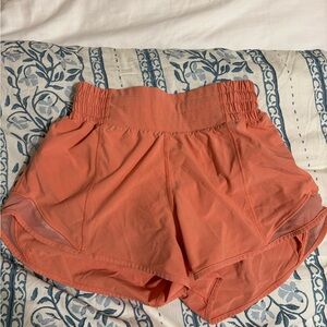 Orange/coral ish size 2 lululemon hotty hots, high rise 2.5